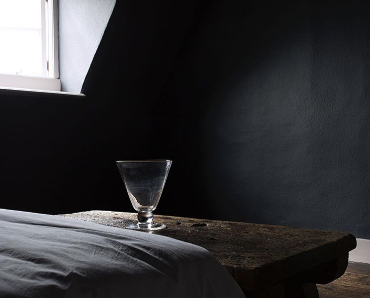 An aged black bedroom via @atelier.ellis