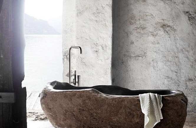 Handcrafted natural stone tub by @muubs via @est_living