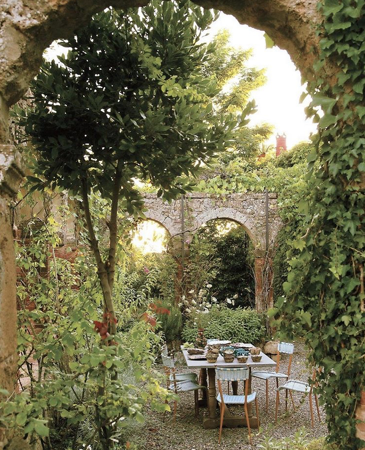 Holly Lueders and Venetia Sacret Young restored a 16th century convent in Tuscany, a view into the original cloister planted with roses, jasmine and herbs, photo by @obertogili, via @tmagazine
