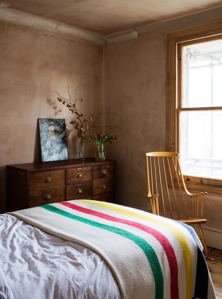 Warm textured walls and hints of colour in this bedroom in Laura Jackson's home