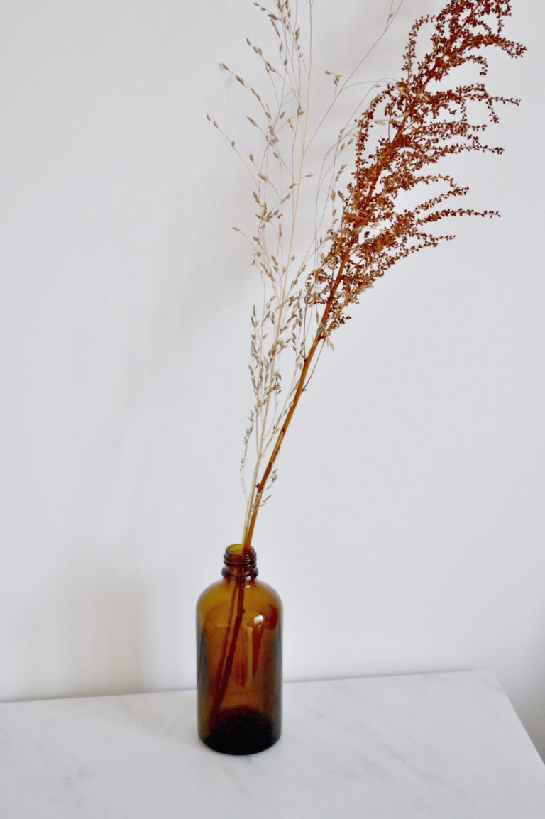 Upcycling BY SARAH LONDON amber glass bottle into a vase with dried foliage